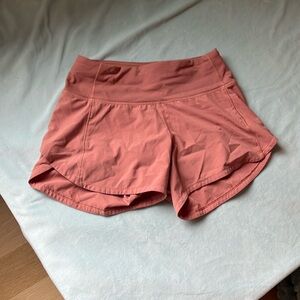 Lululemon speed up shorts low rise 4 inch size 0 orange color